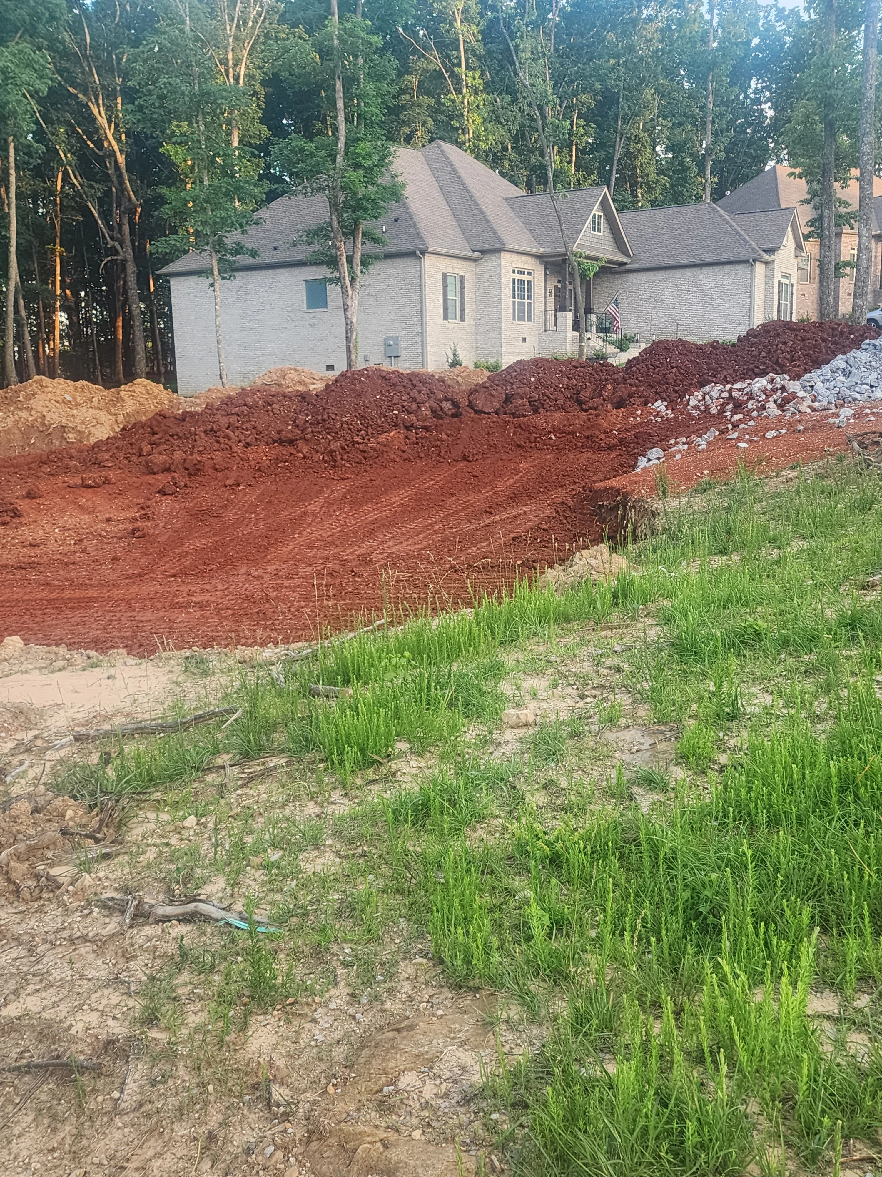 Dump truck hauling dirt and debris from a construction site